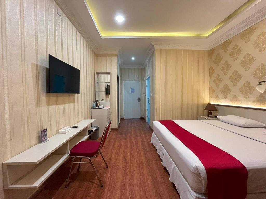 Postel nebo postele na pokoji v ubytování Grand Tamaro Hotel