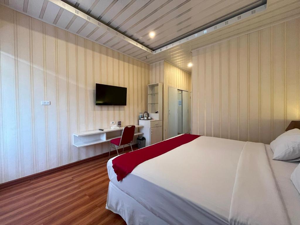 Postel nebo postele na pokoji v ubytování Grand Tamaro Hotel