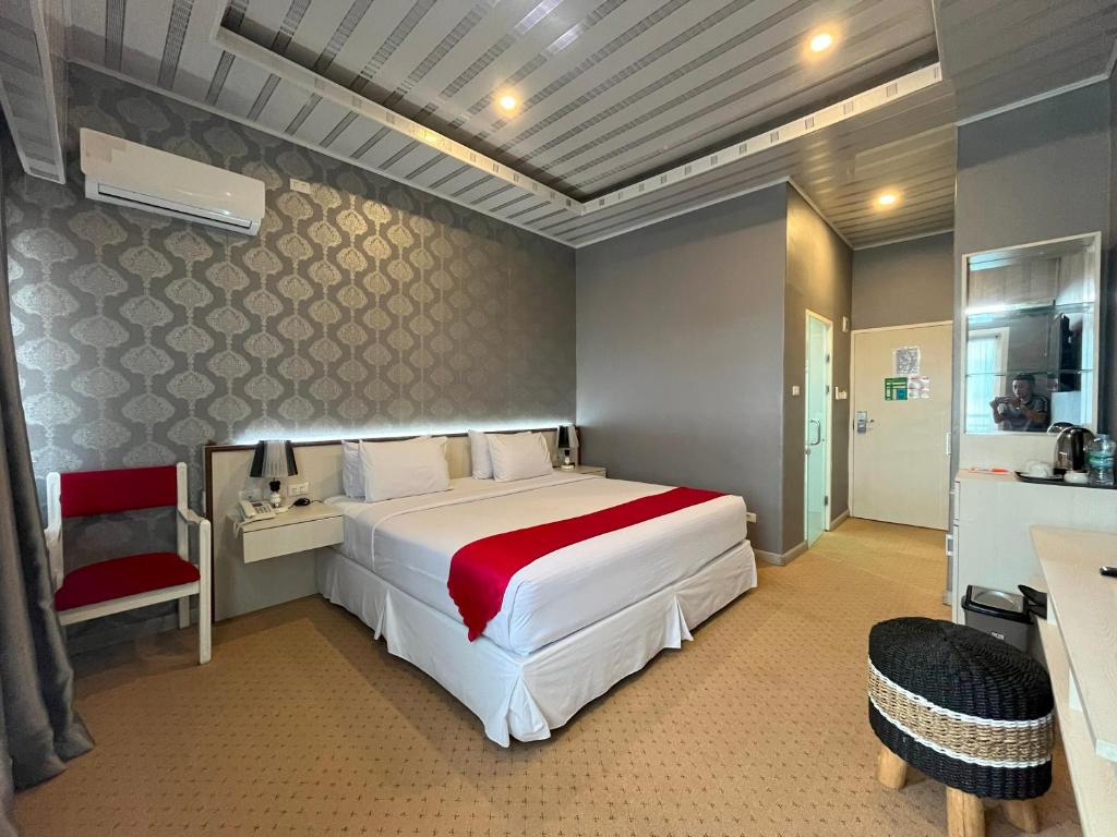 Postel nebo postele na pokoji v ubytování Grand Tamaro Hotel