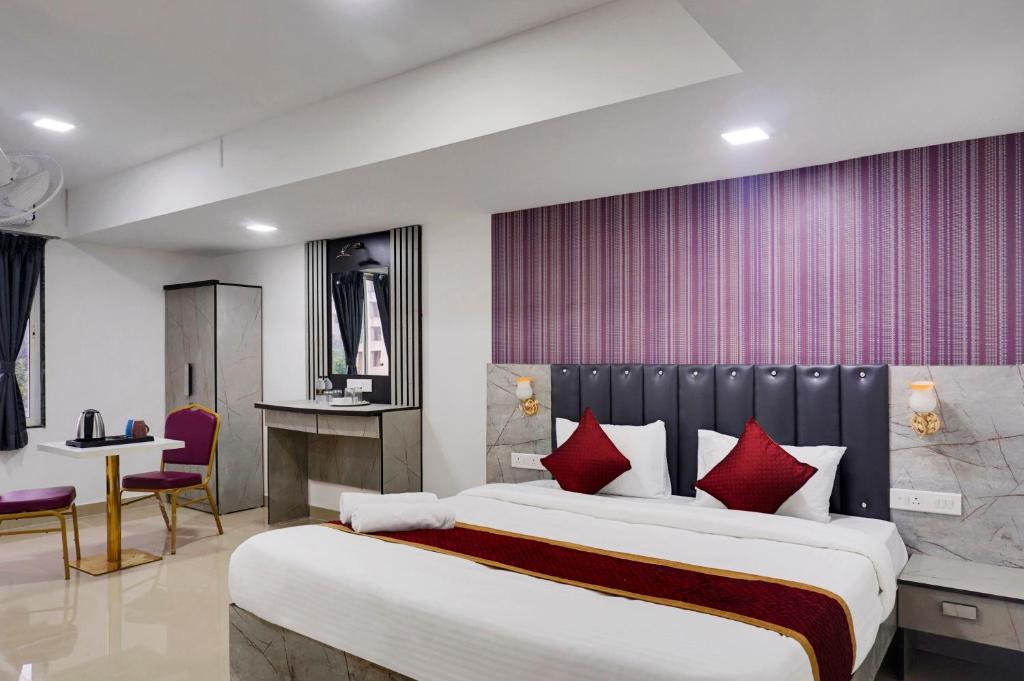 Postel nebo postele na pokoji v ubytování Hotel Orchard Park