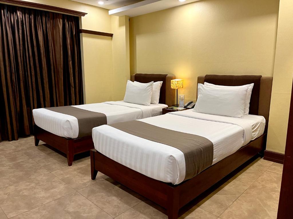 Postel nebo postele na pokoji v ubytování Hotel Del Rio