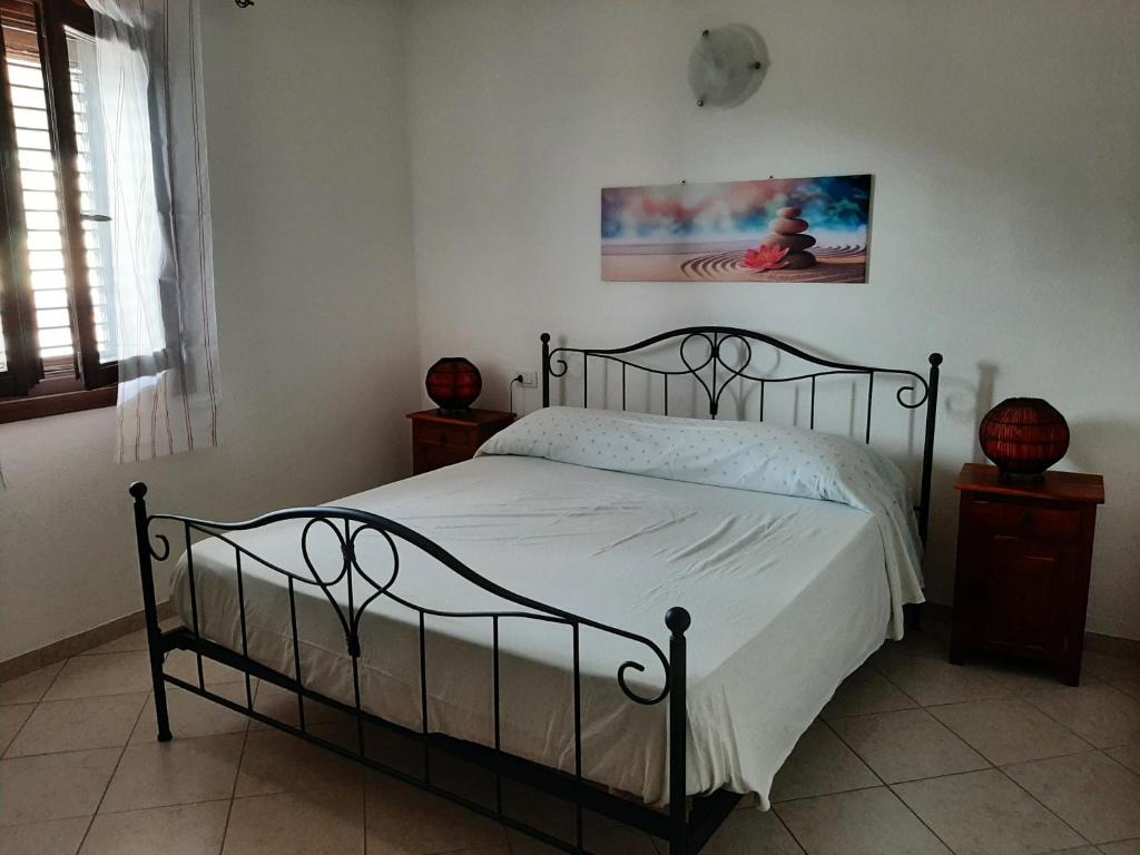 Letto o letti in una camera di Appartamenti I Mandorli