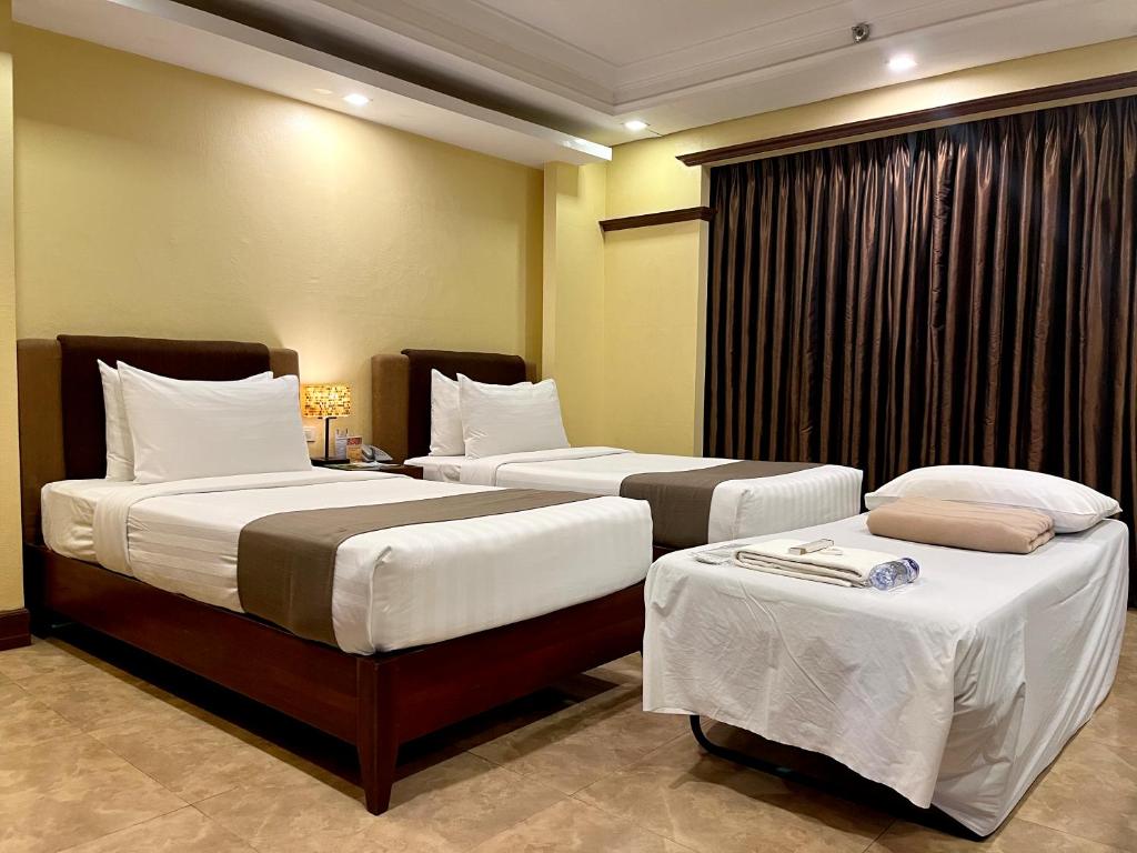 Postel nebo postele na pokoji v ubytování Hotel Del Rio