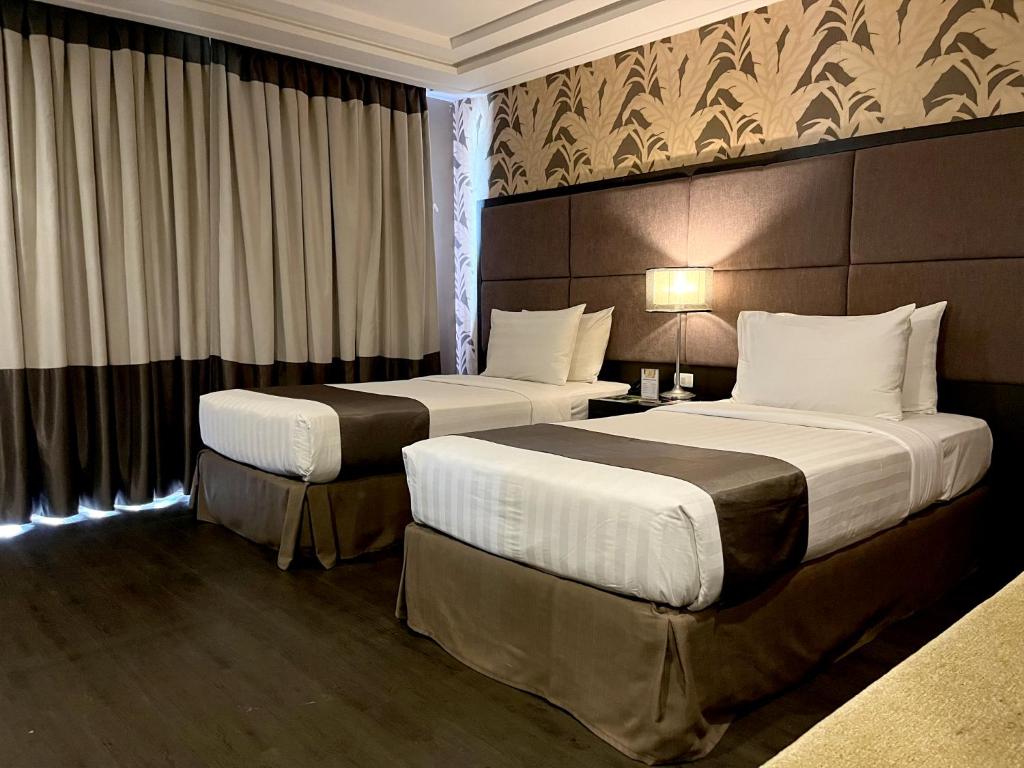 Postel nebo postele na pokoji v ubytování Hotel Del Rio