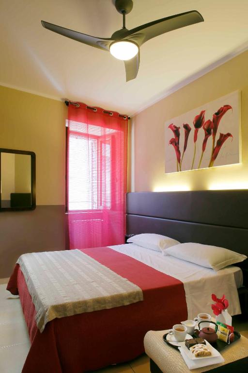 Postel nebo postele na pokoji v ubytování Hotel Properzio
