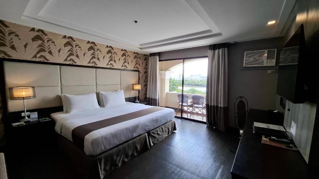 Postel nebo postele na pokoji v ubytování Hotel Del Rio