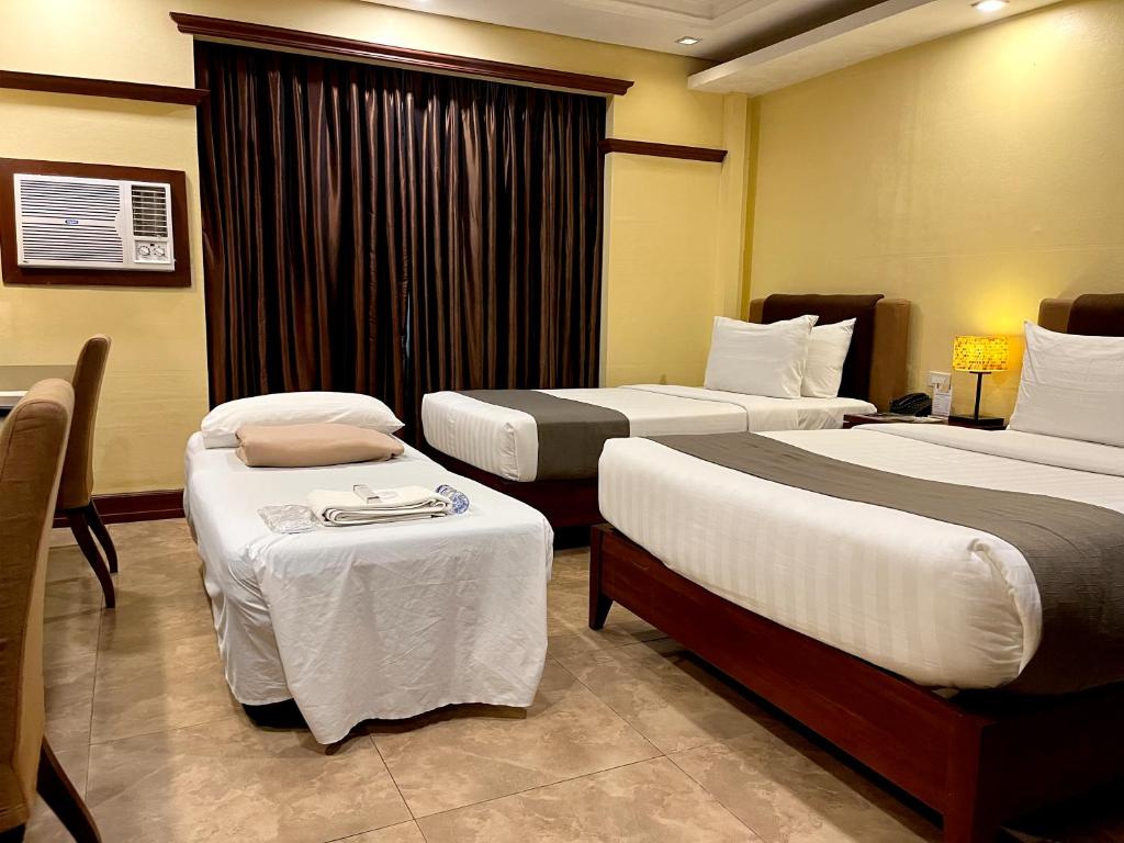 Postel nebo postele na pokoji v ubytování Hotel Del Rio