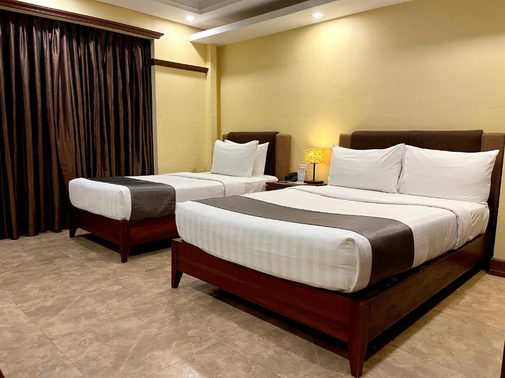 Postel nebo postele na pokoji v ubytování Hotel Del Rio