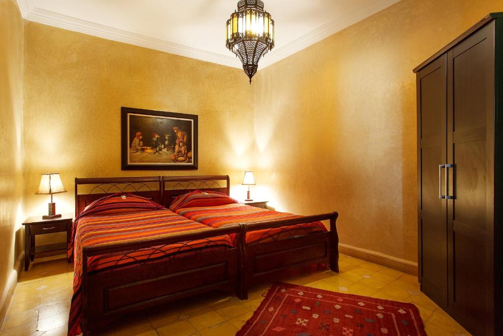 Postel nebo postele na pokoji v ubytování Riad La Kahana