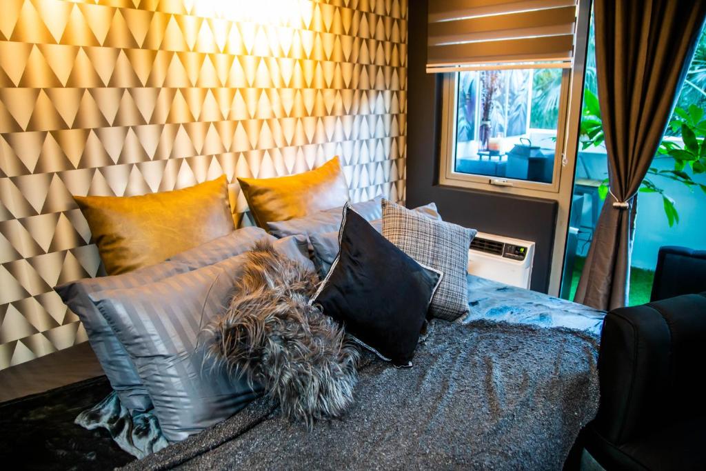 Posezení v ubytování Azure Urban Resort Staycation by Solace Peak 3 1Bedroom with PS4