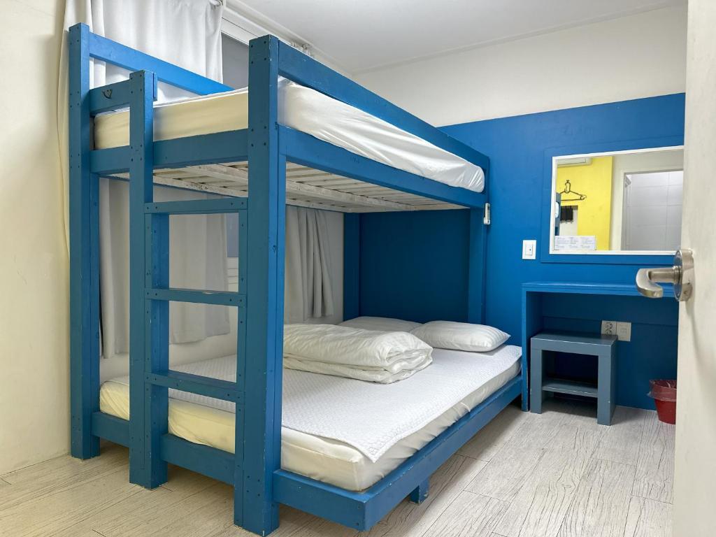 Postel nebo postele na pokoji v ubytování Slow Citi Guest House -슬로시티게스트하우스