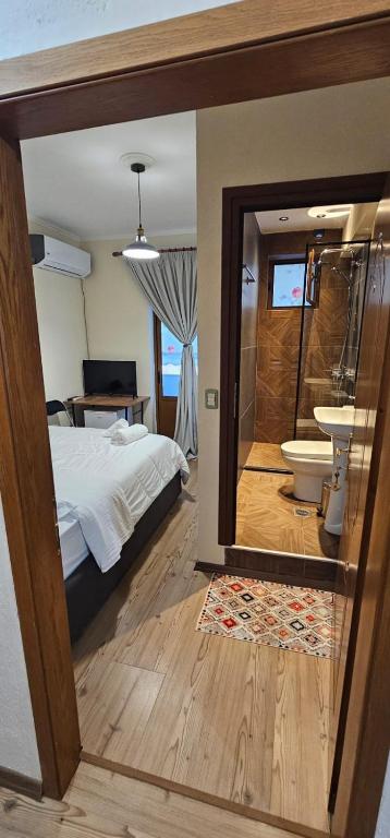 Postel nebo postele na pokoji v ubytování Hotel Sofra