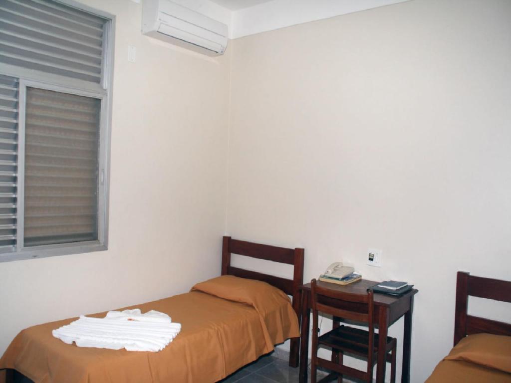 Postel nebo postele na pokoji v ubytování Scala Hotel Barretos