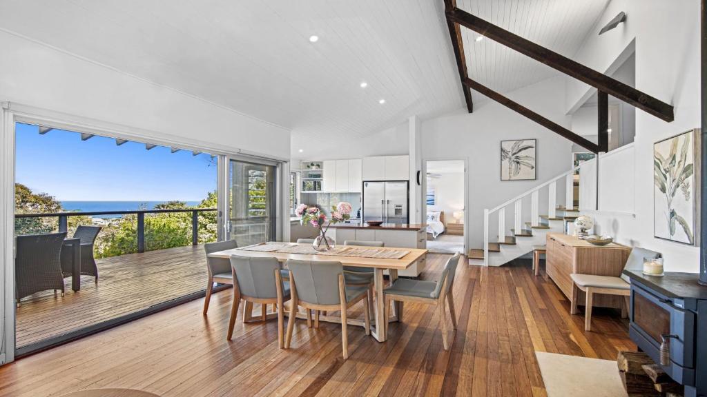 a kitchen and dining room with a table and chairs at Copa Sunrise Ocean Views, Close To Beach in Copacabana