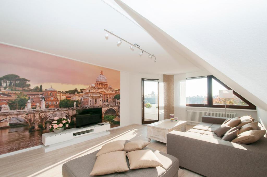 a living room with a large painting on the wall at Ferienwohnung Nilsson in Halstenbek