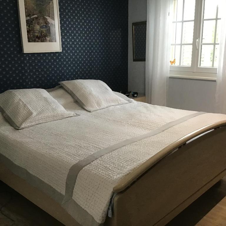Postel nebo postele na pokoji v ubytování Chambres d hôte Clos du Noyer