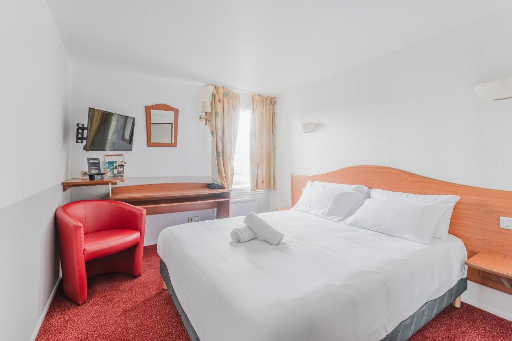 Postel nebo postele na pokoji v ubytování Cap Hôtel