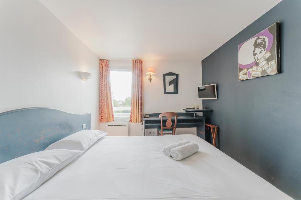 Postel nebo postele na pokoji v ubytování Cap Hôtel
