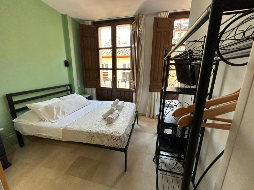 Postel nebo postele na pokoji v ubytování Hostal El Olivo
