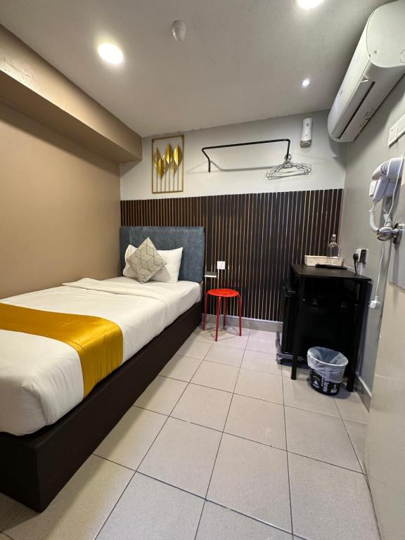 Postel nebo postele na pokoji v ubytování SS Grey Hotel 2