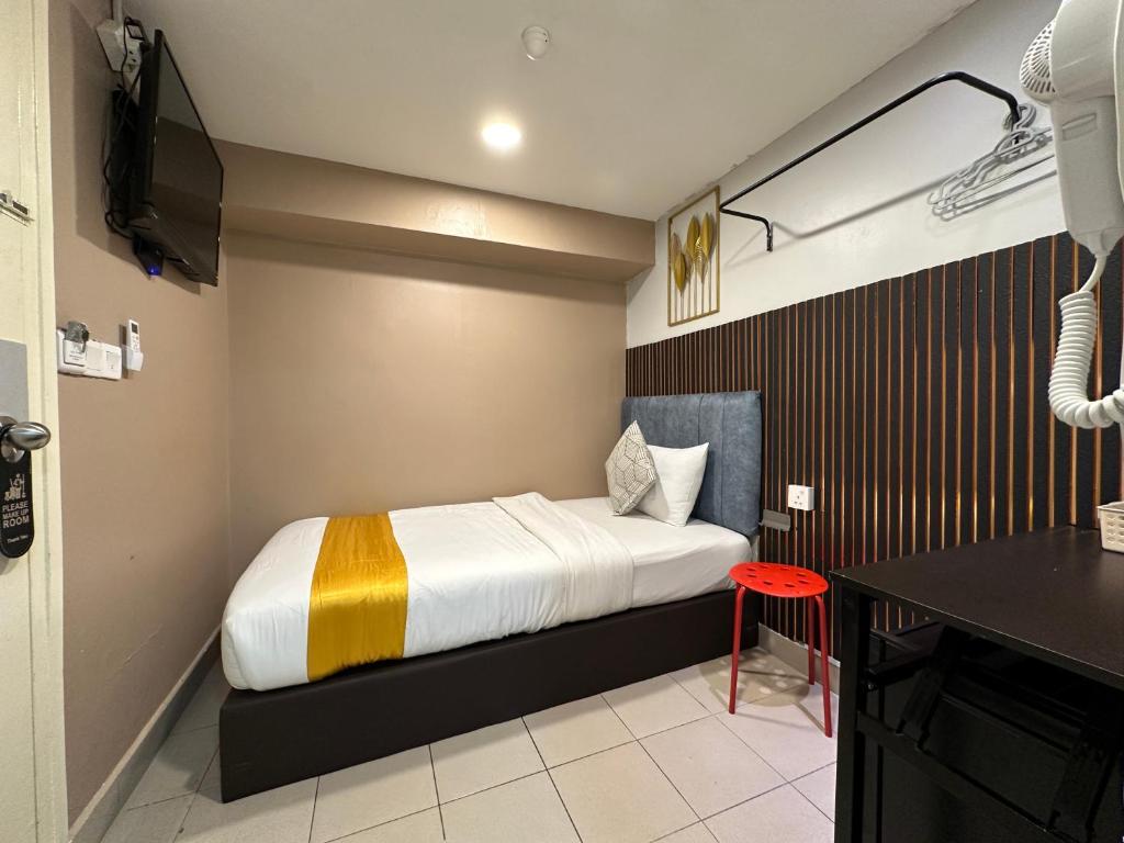 Postel nebo postele na pokoji v ubytování SS Grey Hotel 2