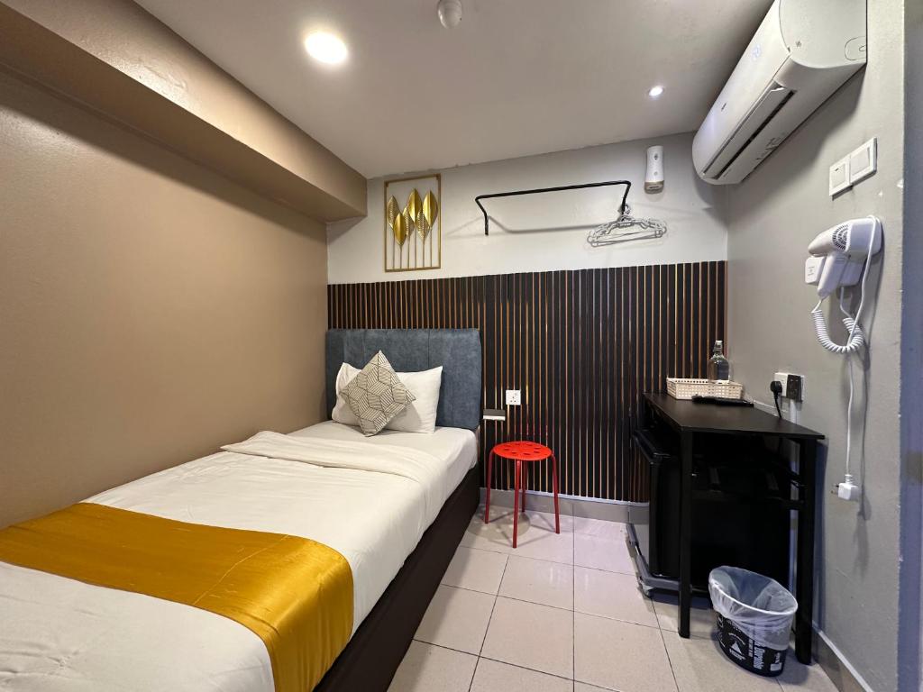 Postel nebo postele na pokoji v ubytování SS Grey Hotel 2