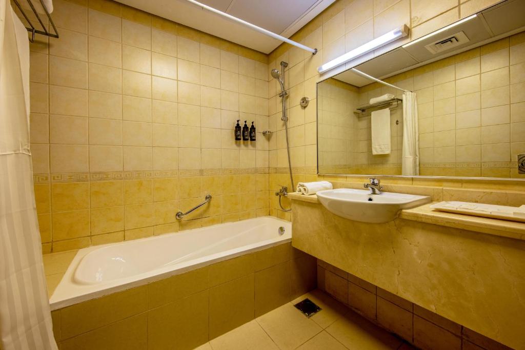 Koupelna v ubytování TIME Ruby Hotel Apartment