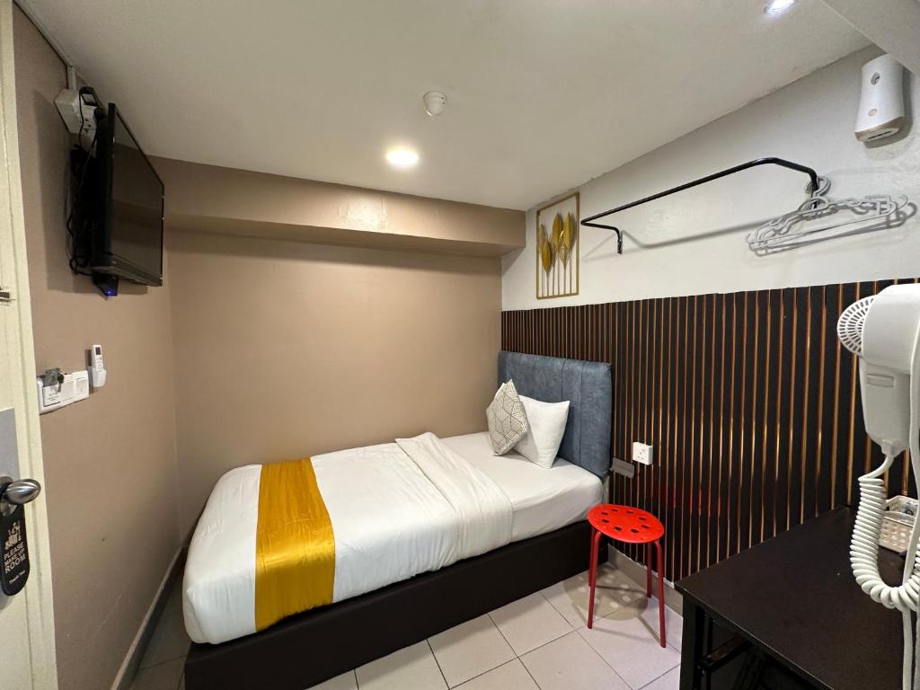 Postel nebo postele na pokoji v ubytování SS Grey Hotel 2