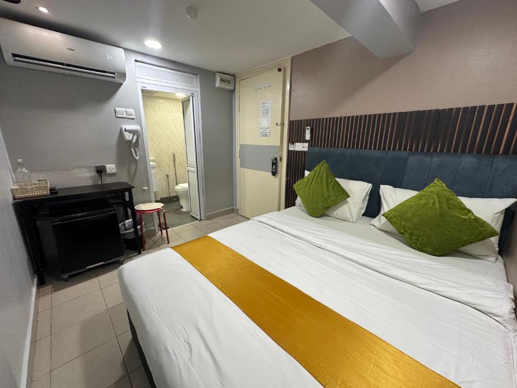 Postel nebo postele na pokoji v ubytování SS Grey Hotel 2