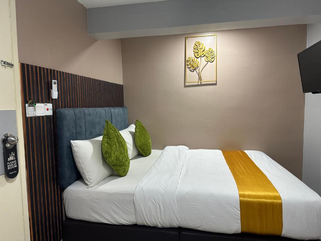 Postel nebo postele na pokoji v ubytování SS Grey Hotel 2