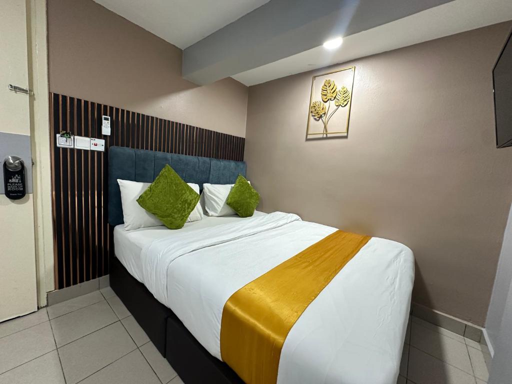 Postel nebo postele na pokoji v ubytování SS Grey Hotel 2