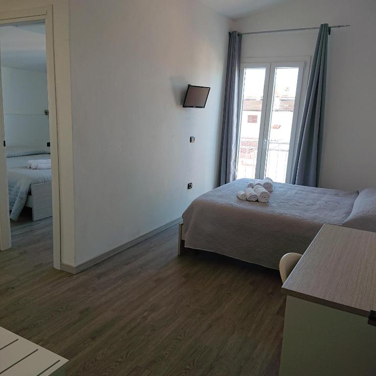Posteľ alebo postele v izbe v ubytovaní Hotel Ogliastra