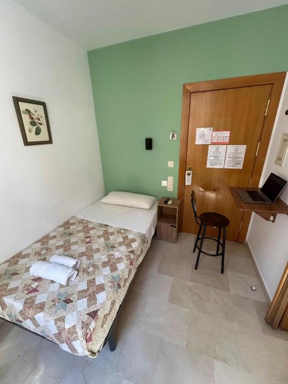 Postel nebo postele na pokoji v ubytování Hostal El Olivo
