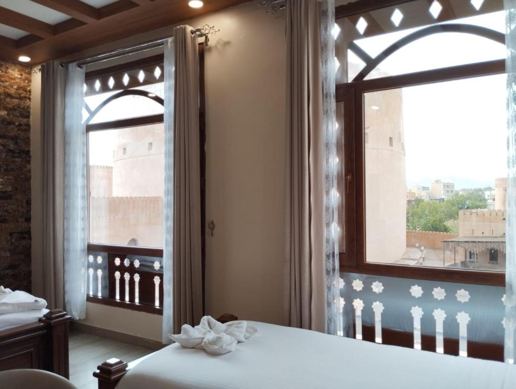 Postel nebo postele na pokoji v ubytování Durrat Nizwa Inn