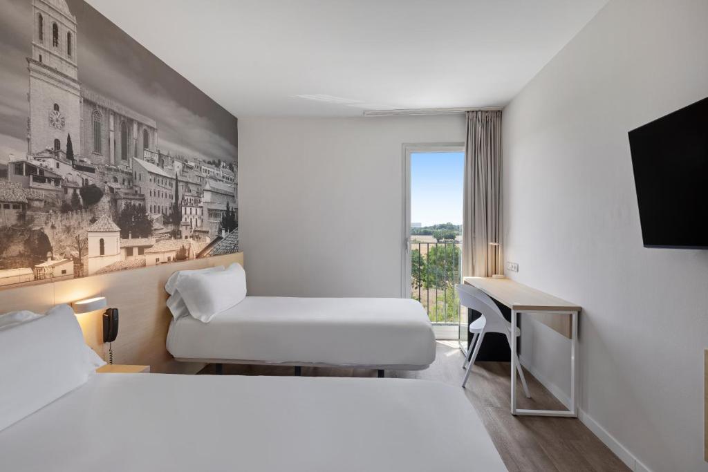 Postel nebo postele na pokoji v ubytování B&B HOTEL Girona 3