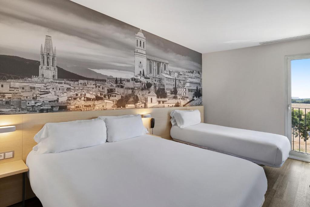 Postel nebo postele na pokoji v ubytování B&B HOTEL Girona 3