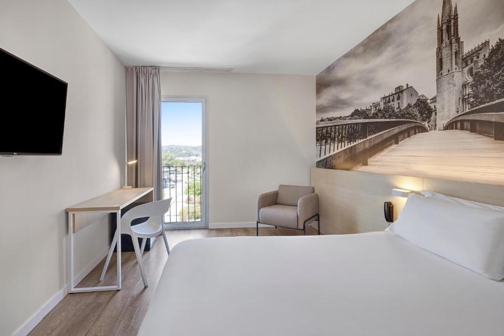 Postel nebo postele na pokoji v ubytování B&B HOTEL Girona 3