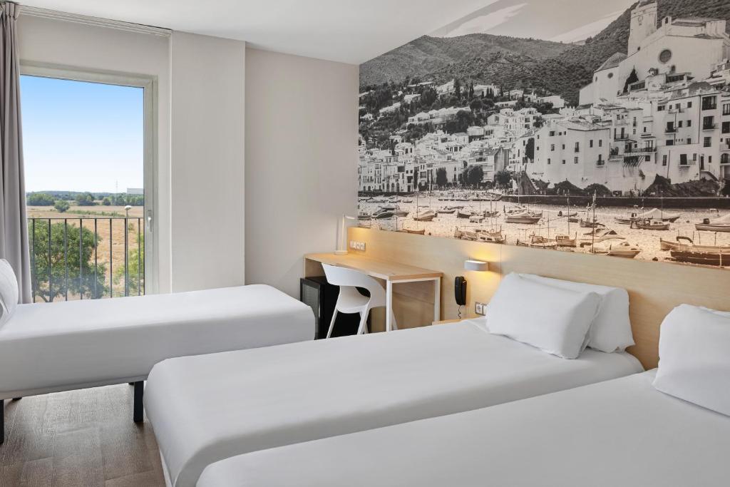 Postel nebo postele na pokoji v ubytování B&B HOTEL Girona 3