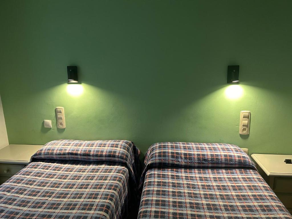 Postel nebo postele na pokoji v ubytování Hostal El Olivo