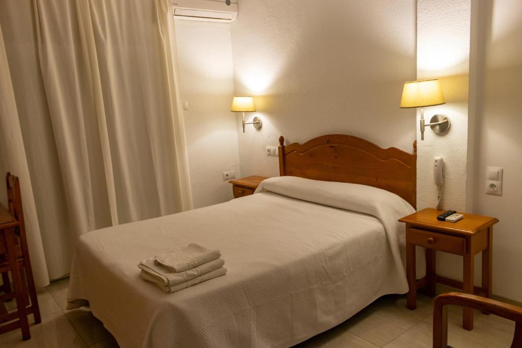 Postel nebo postele na pokoji v ubytování Hotel Philadelfia