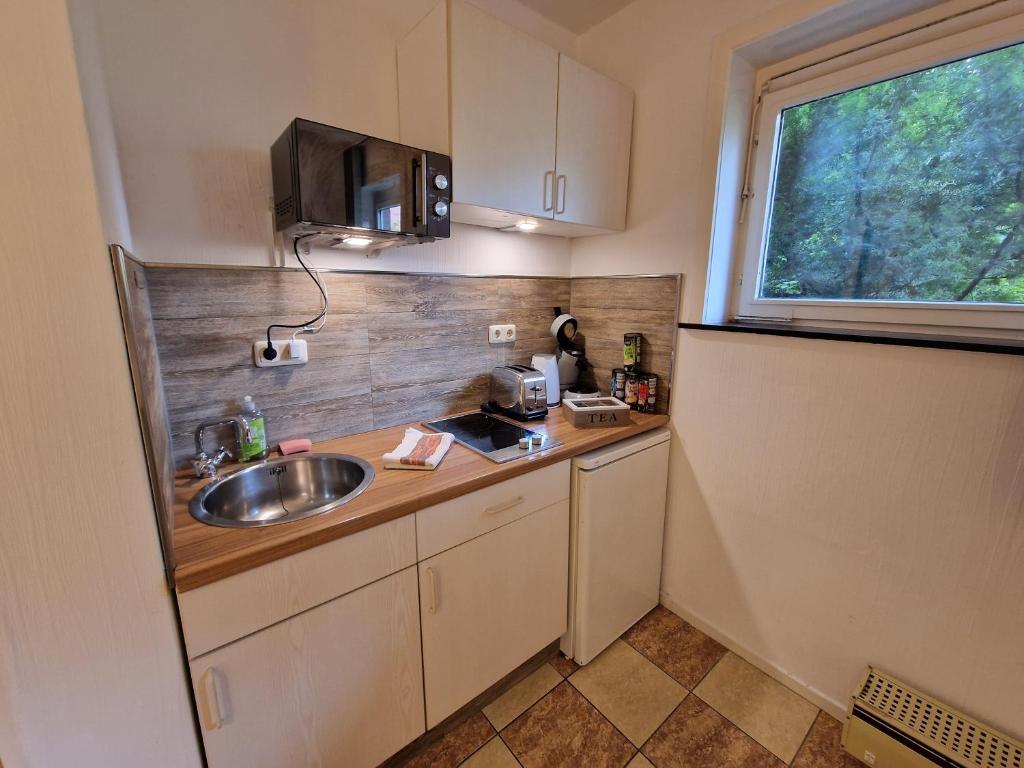 Kuchyň nebo kuchyňský kout v ubytování Das Hanse Quartier