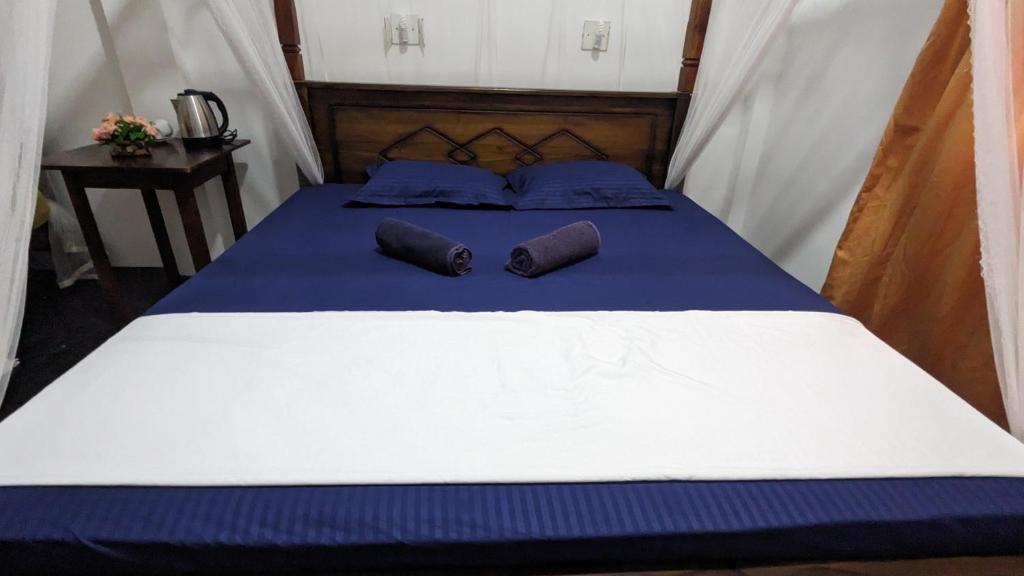 Postel nebo postele na pokoji v ubytování Mirissa Senaliya Guest