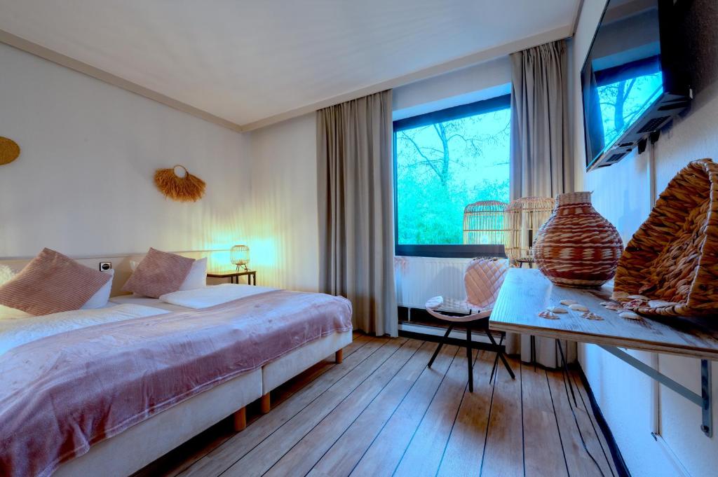 Postel nebo postele na pokoji v ubytování Hotel Waldkur
