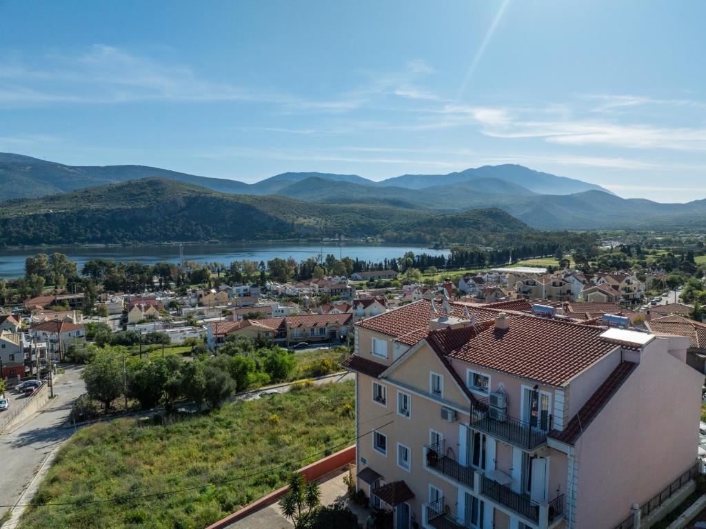 a view of a town with a river and mountains at Elisso Apartment in Argostoli