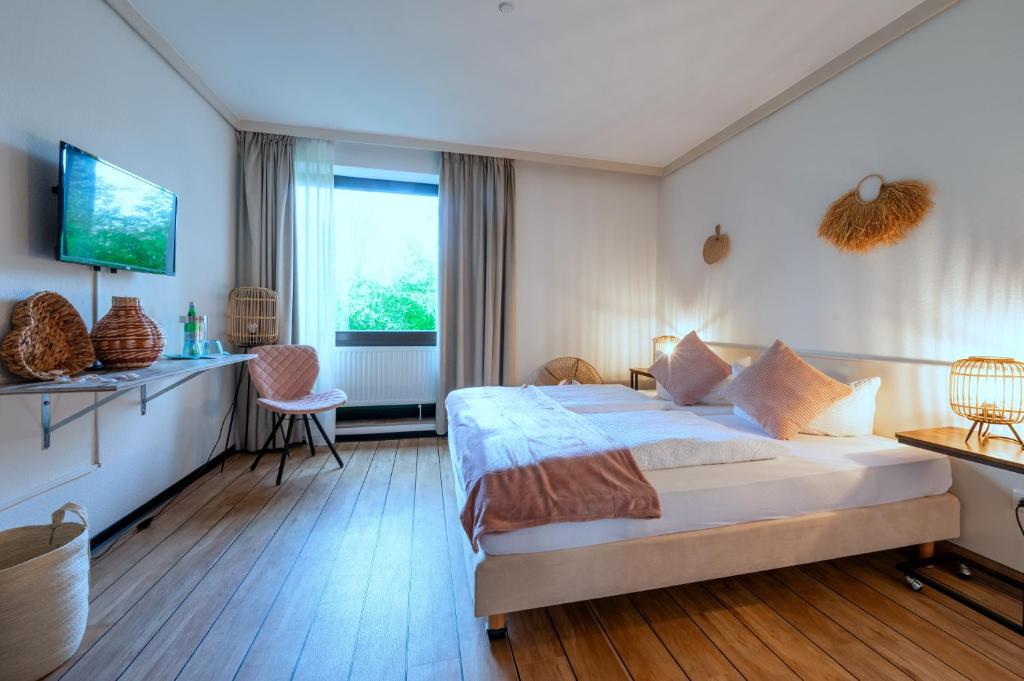 Postel nebo postele na pokoji v ubytování Hotel Waldkur