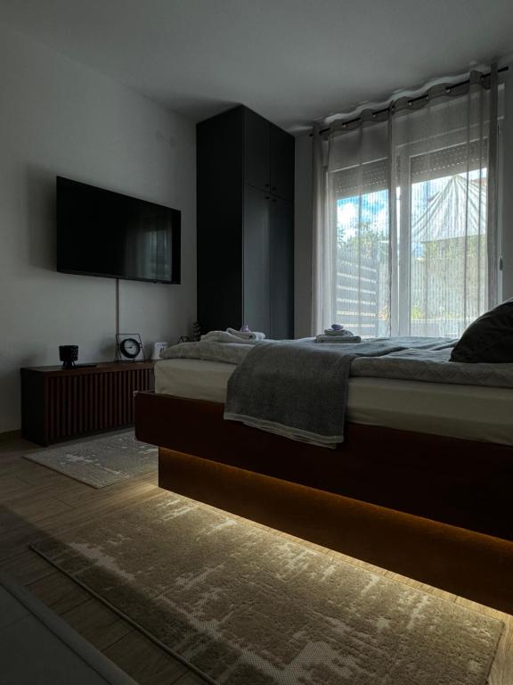 Postel nebo postele na pokoji v ubytování Apartmani Viver Vrnjačka Banja