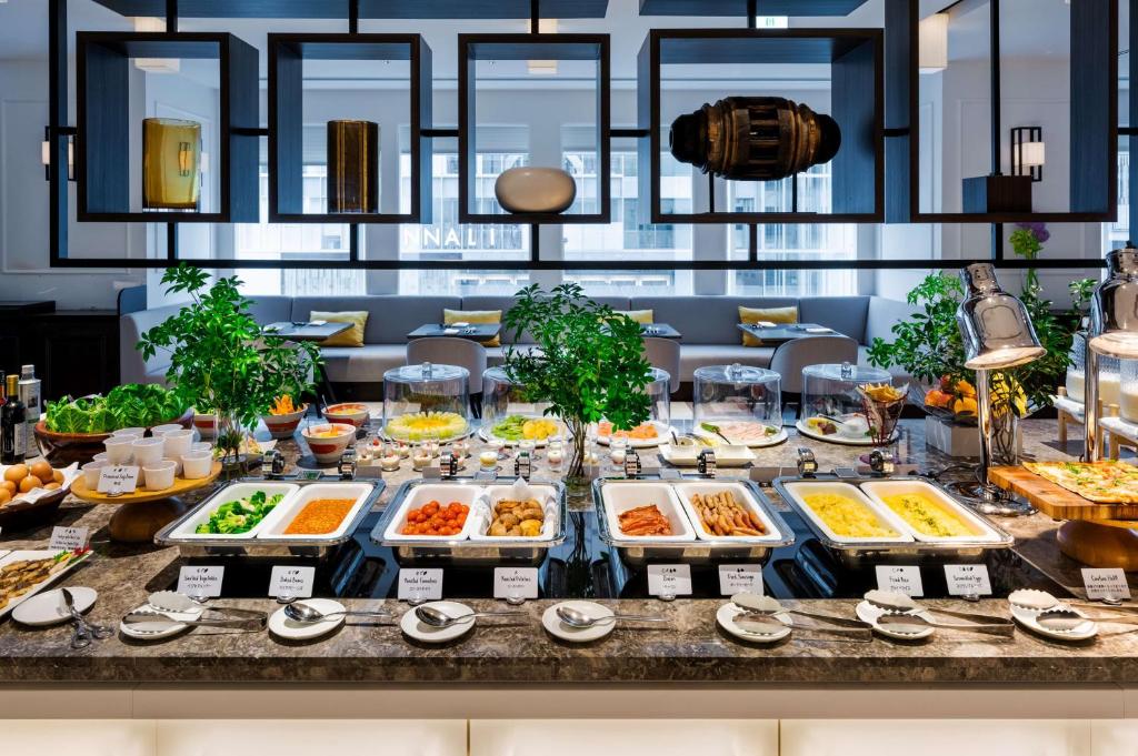 a buffet of food on a table at Hilton Osaka Hotel in Osaka