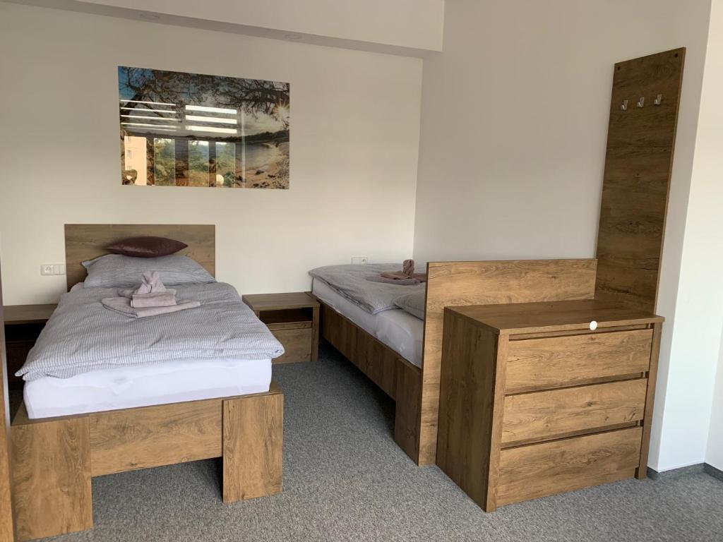 Postel nebo postele na pokoji v ubytování Kamrovec