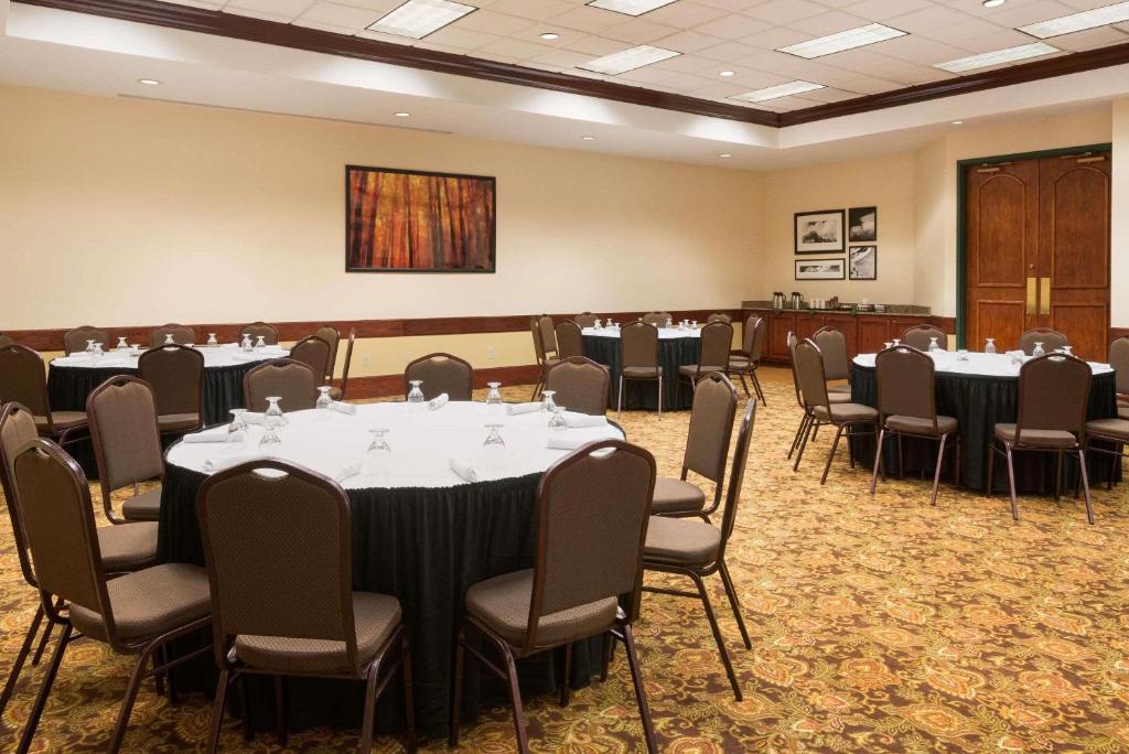 a conference room with tables and chairs in it at Country Inn & Suites by Radisson, Beckley, WV in Beckley