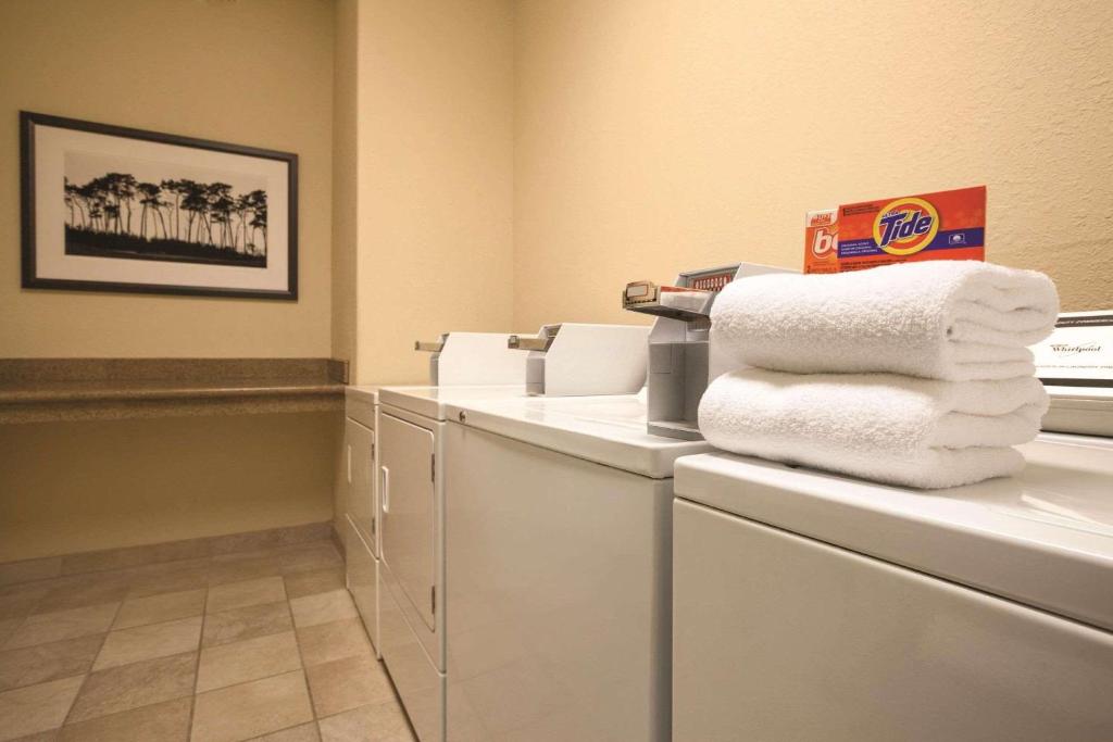 a pile of towels sitting on a counter in a room at Country Inn & Suites by Radisson, Beckley, WV in Beckley